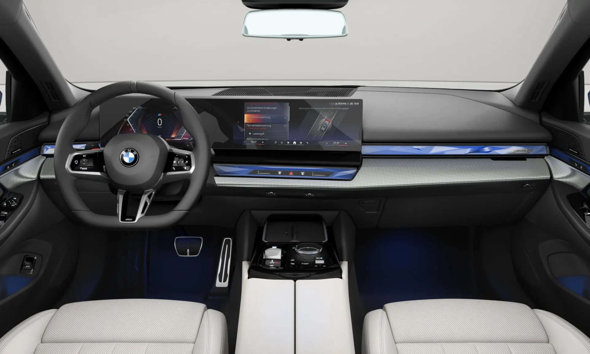 Řada 5 Touring (G61), M sportovní paket, BMW Individual metalický lak Tanzanite Blue, interiér Umělá kůže Veganza perforovaná a prošívaná Smoke White, dashboard