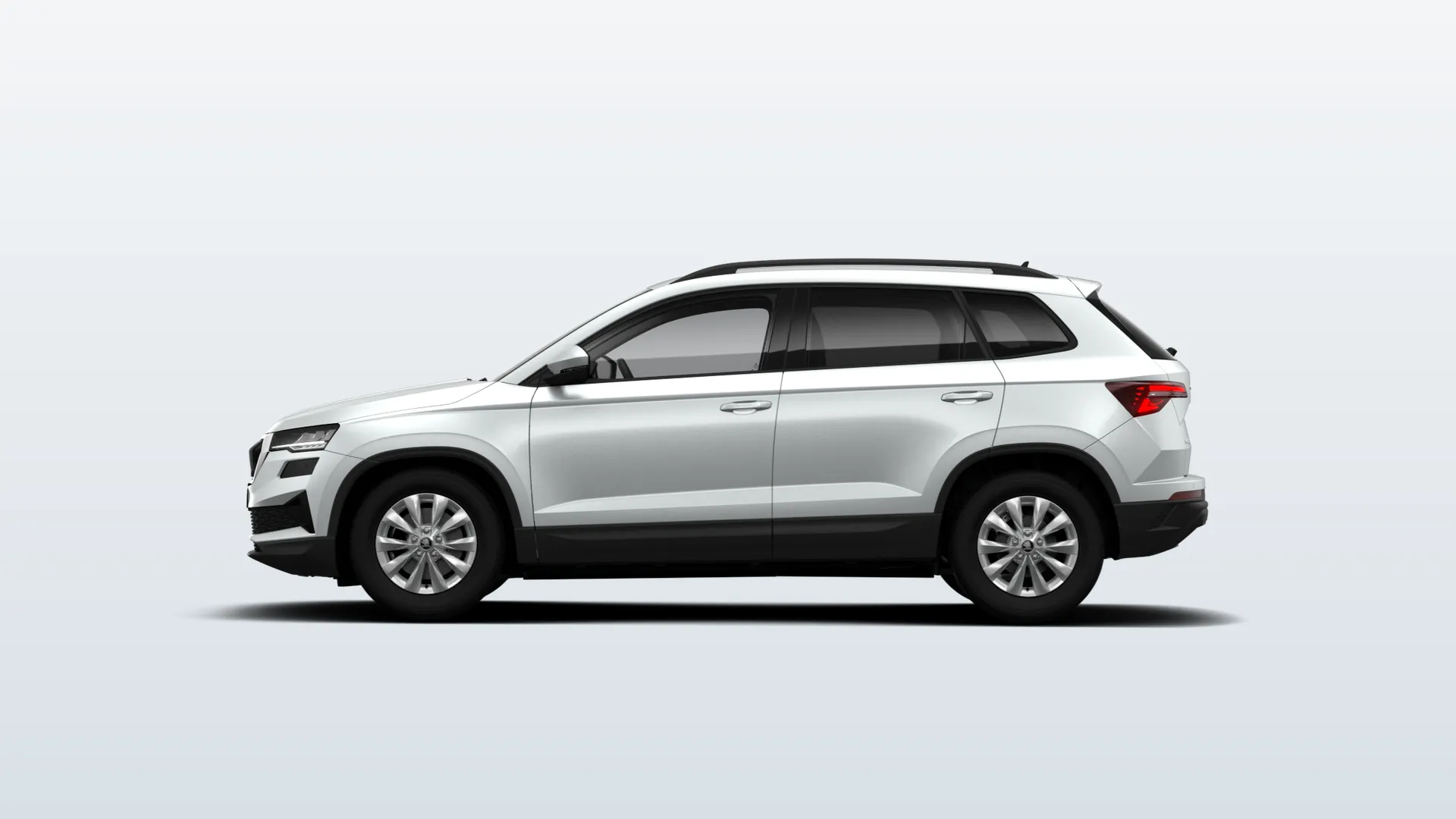Škoda Karoq (facelift 2021) Selection v barvě Bílá Moon metalíza – pohled z boku